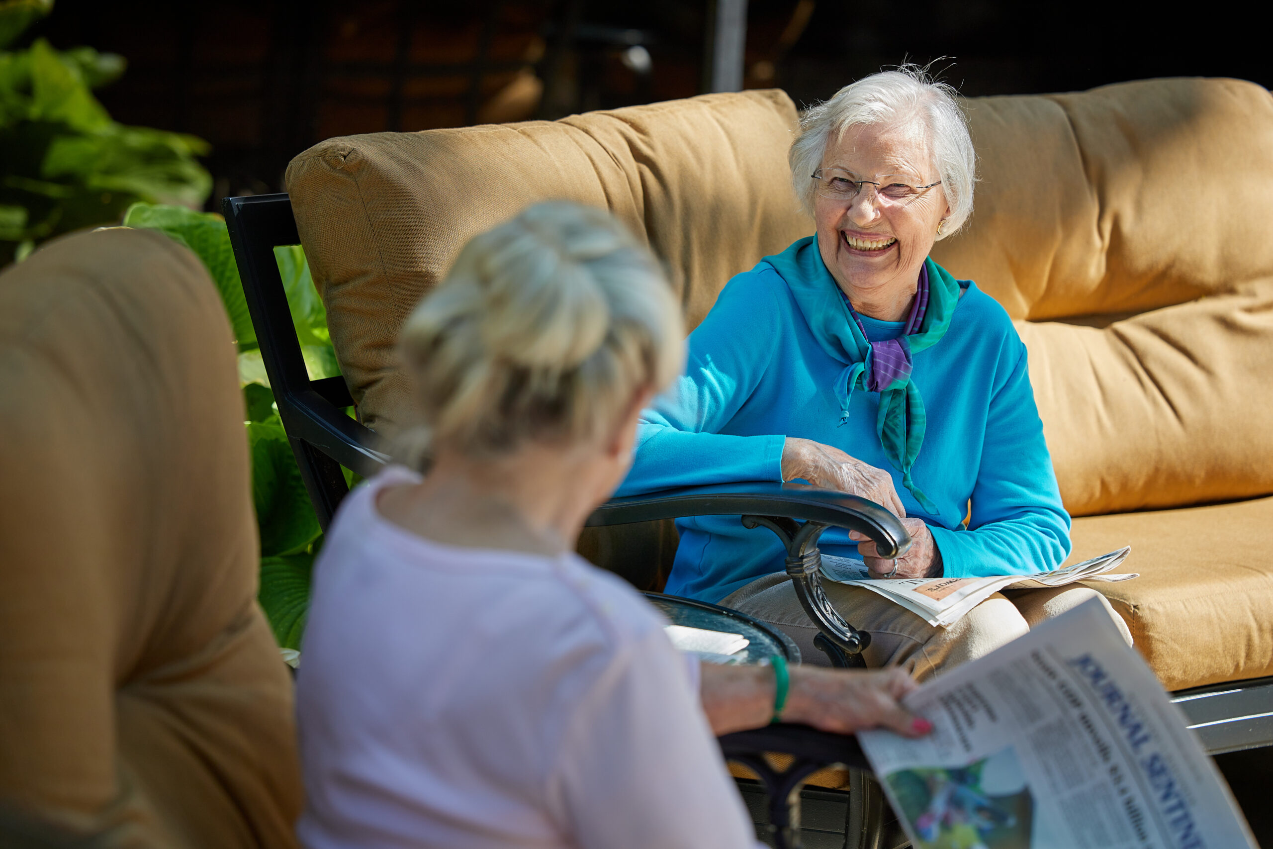 Two seniors sitting on the patio